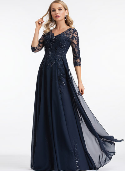 A lady wearing a black beautiful gown